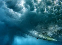 The Ride. This photo was taken under a breaking wave at S... by Mathew Cook 